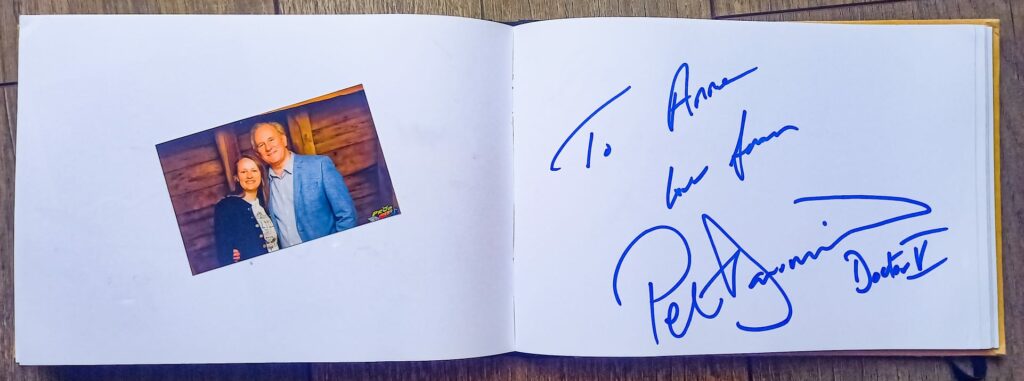 autograph of Peter Davison, next to a photo with him from the photo op